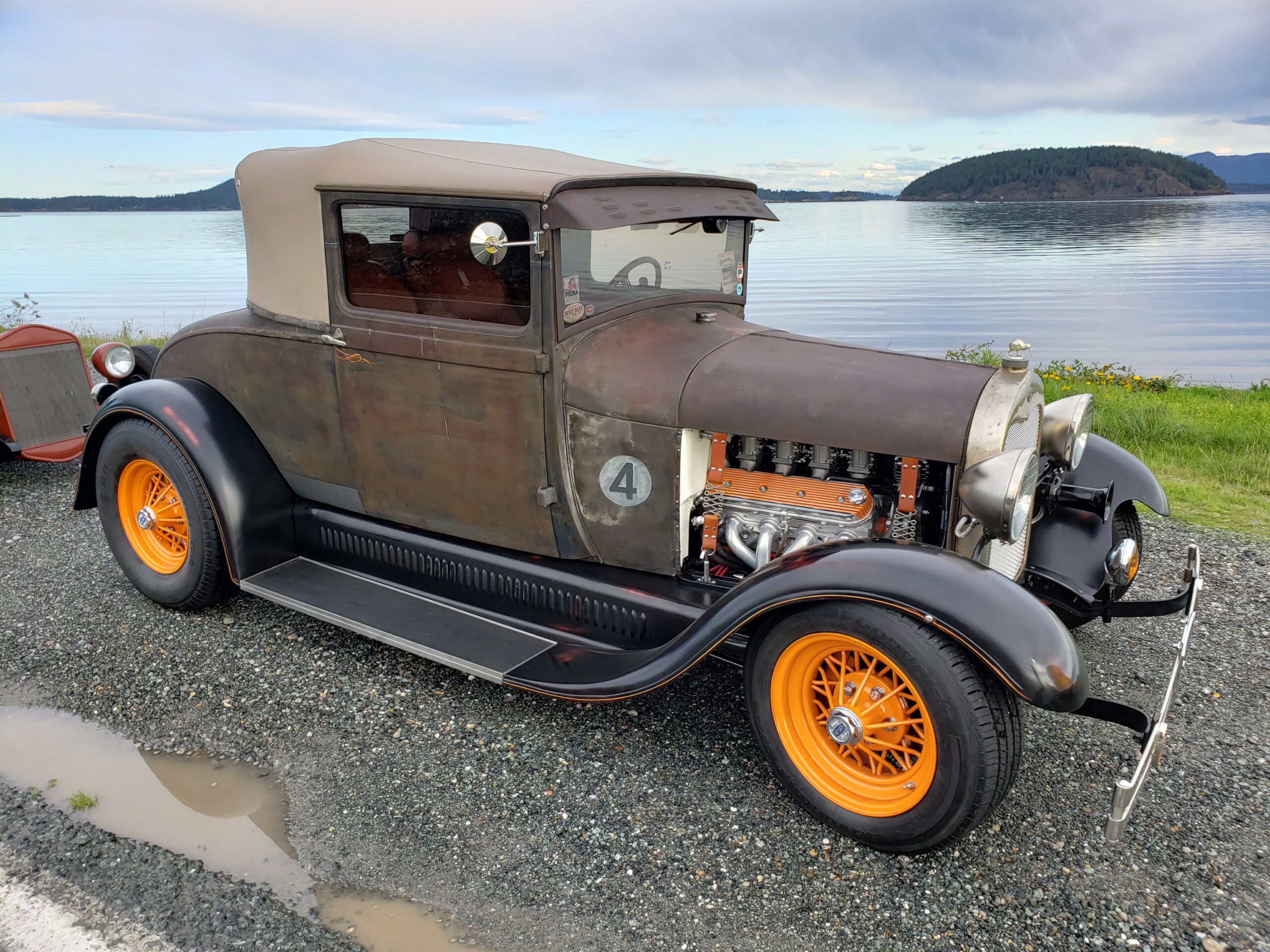 Brown 1928 Ford Model A Sports Coupe with orange wheels.